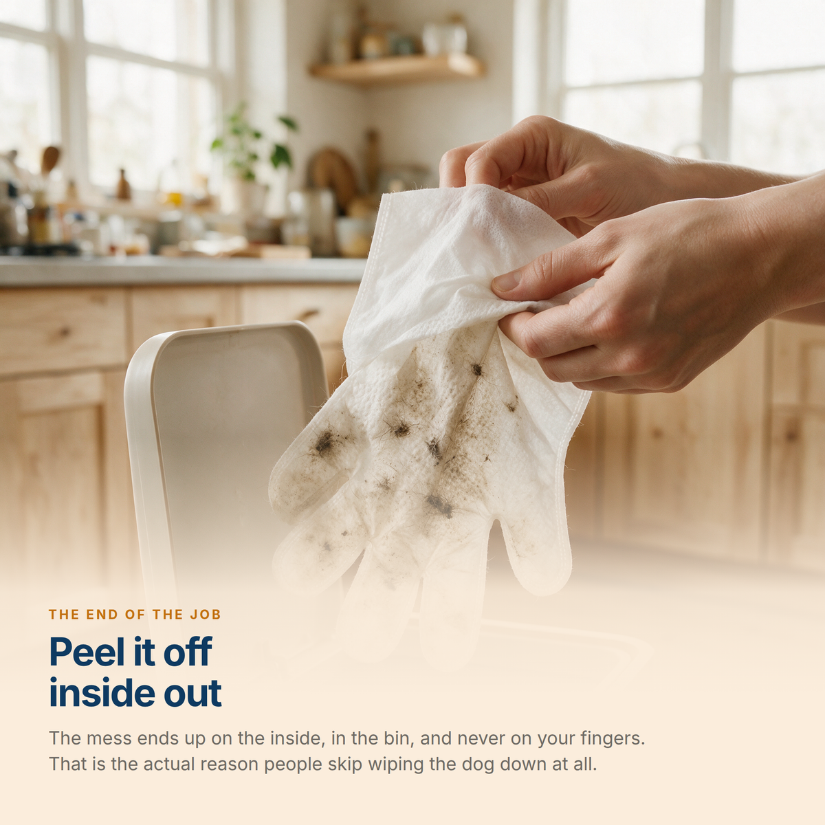A used Mitt Wipe being peeled off inside out over a bin, with the dirt trapped on the inside
